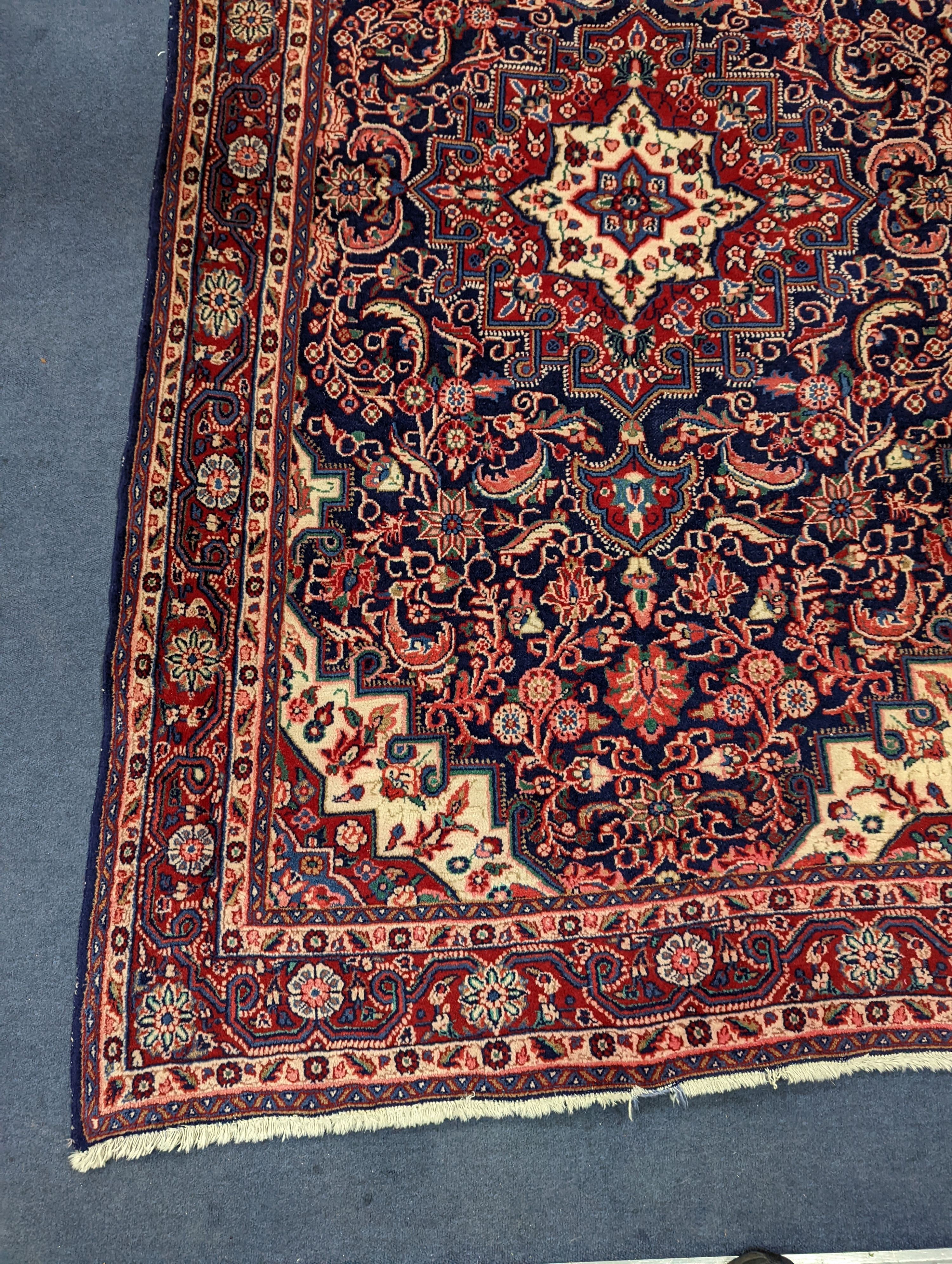 A North West Persian blue ground rug, 210 x 130cm